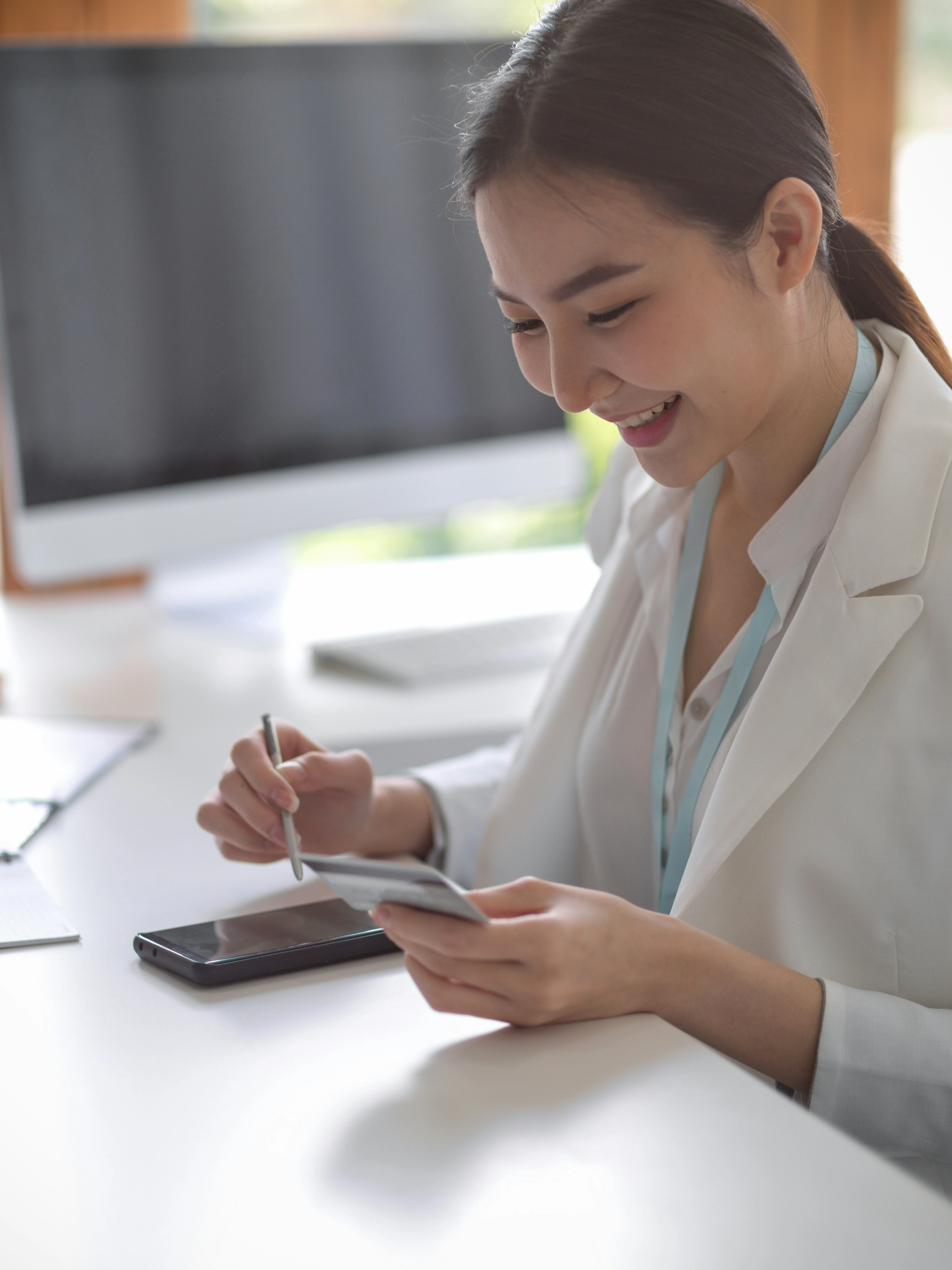 Patient reviewing treatment cost on her phone